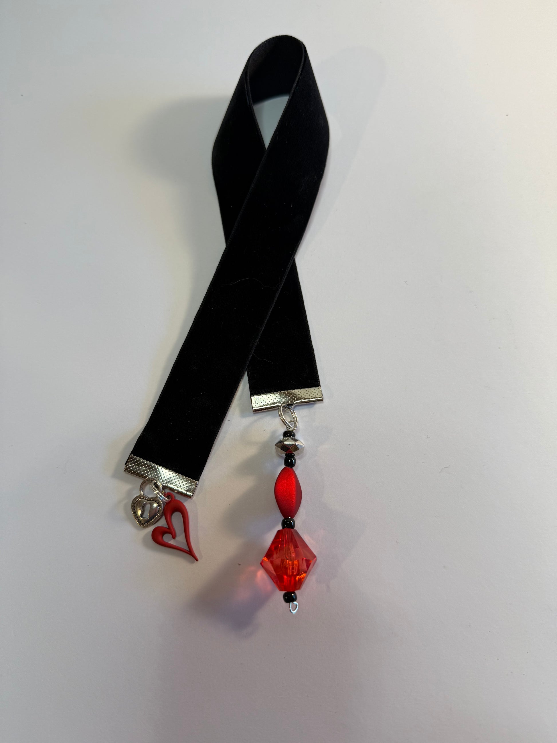black velvet bookmark with red heart charm.