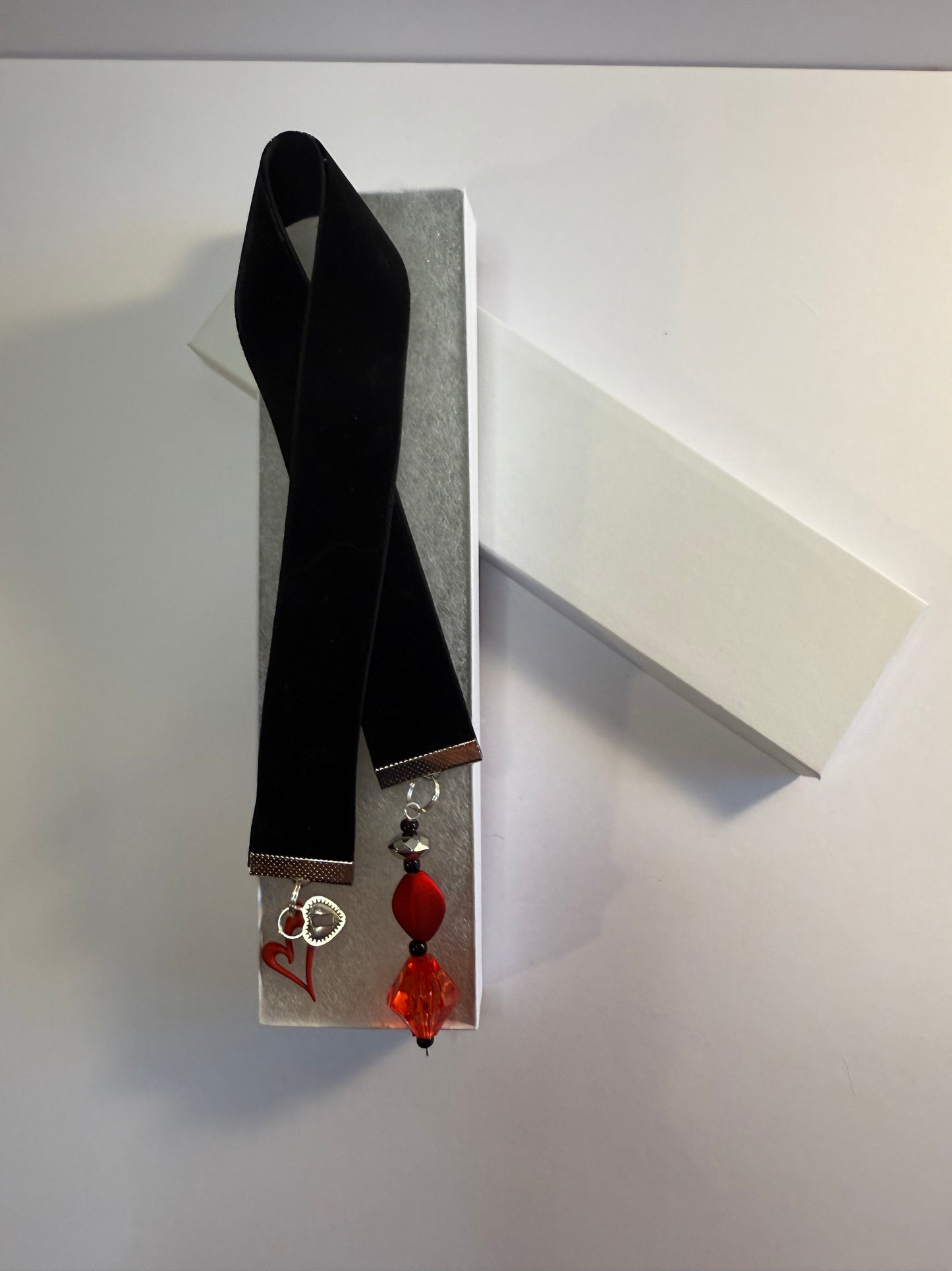 black velvet bookmark with red heart charm in gift box