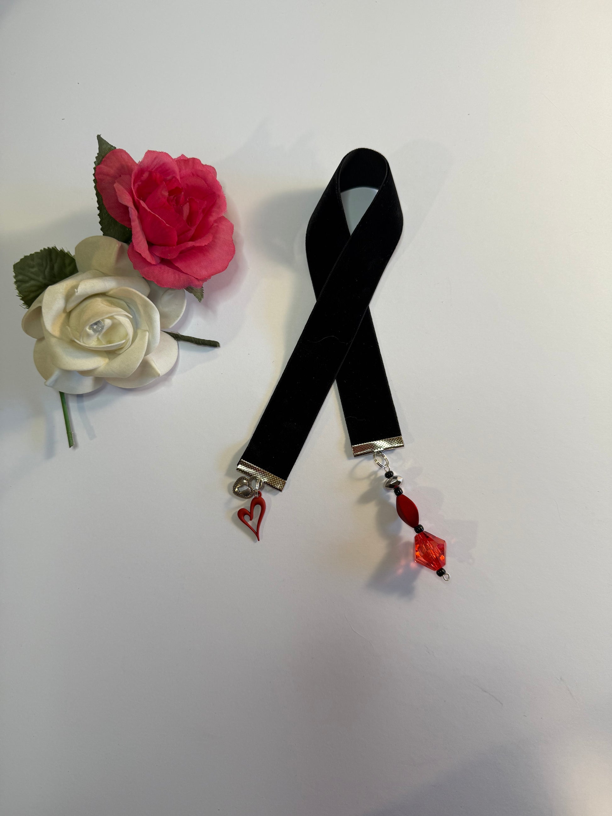 black velvet bookmark with red heart charm.
