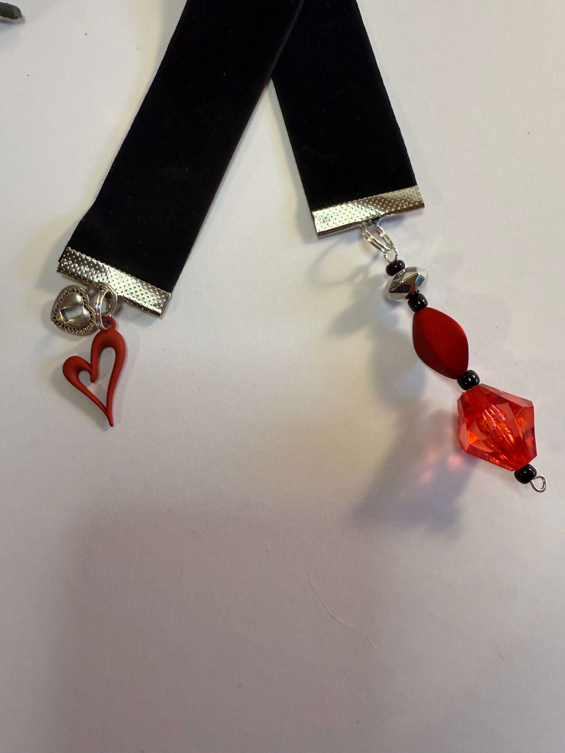 black velvet bookmark with red heart charm.